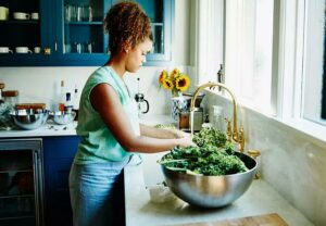 person Washing Veggies at sink 675994329 770x533 1 jpg