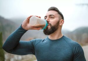 person drinks protein drink 1291853061 770x533 1 jpg